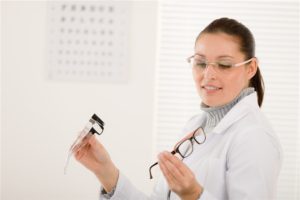 Optician choosing eyeglasses