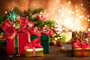 Christmas holidays composition with gift boxes on wooden background